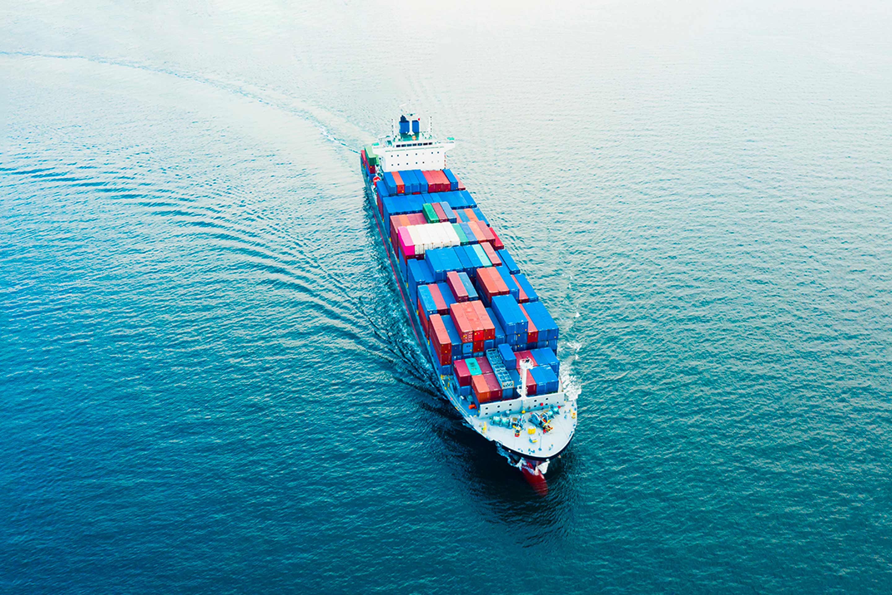 An image of a container ship at sea to represent OMT interview